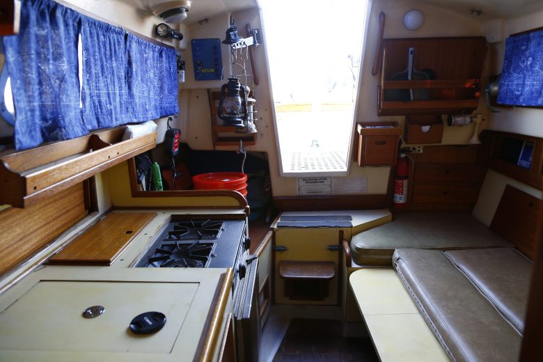 Here's Windspell's interior looking aft. Note the dinette shown folded down into a berth.