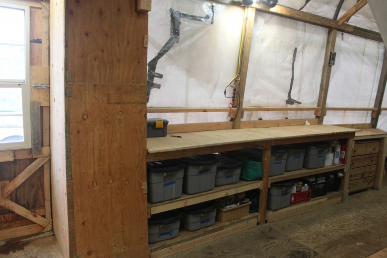 Long work bench and storage closet.